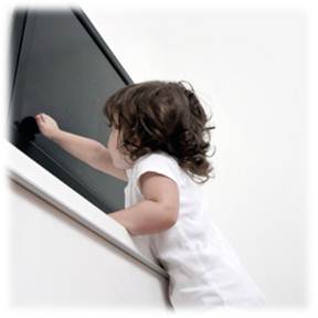 Kid reaching for TV photo